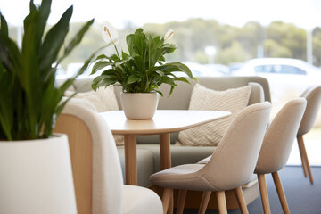 Fototapeta premium serene office space featuring natural wood furniture soft ambient lighting and lush greenery