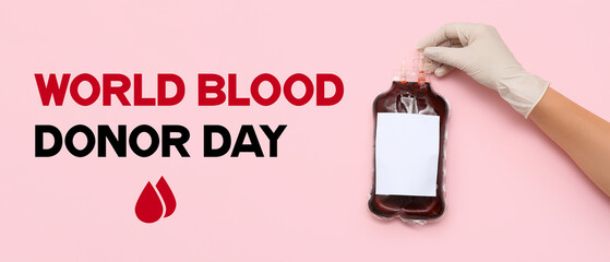 Female hand in rubber glove holding blood pack for transfusion on pink background