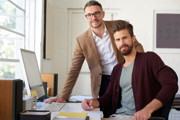 Business, portrait and men on computer in office for research, planning and ideas as web designer...