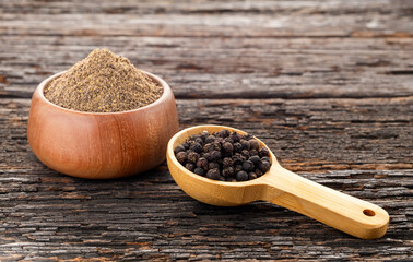 Piper nigrum - Aromatic black pepper in a bowl and spoon