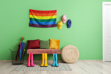 Interior of hall with bench, gumboots and LGBT flag