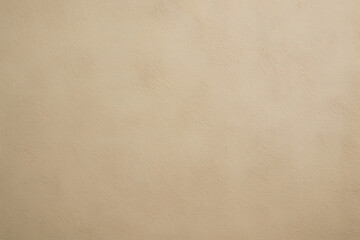 Fototapeta premium An abstract close-up of a solid light brown textured surface, resembling a painted wall or paper