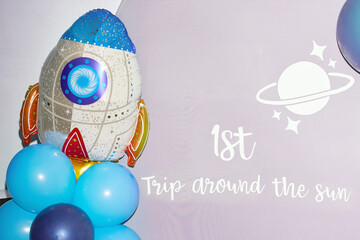 Space-Themed Birthday Backdrop with Rocket and Balloons
