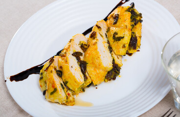 Delicious turkey breast grilled with olives and prunes, garnished with balsamic sauce