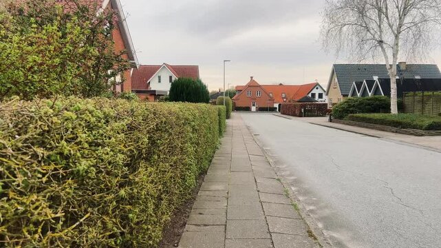 Street with old houses leading to the Domkirke church in Viborg, Denmark. The old city in Denmark. Traditional danish architecture. Midtjylland. Cityscape at dusk. Scandinavian street at sunset.
