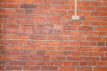 This photo is of an inbox installed in a brick wall