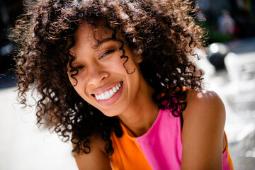 Photo of positive young girl cheerful smile wear colorful outfit walk park sunlight spring weather...