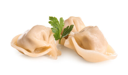 Delicious boiled dumplings with parsley on white background