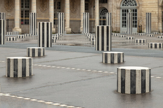 France,Paris-May 3,2025 - The Burens Columns (the two trays) installed in the Honor courtyard of the Palais Royal, A Contemporary Art is made of 260 black and white striped columns, columns take root.