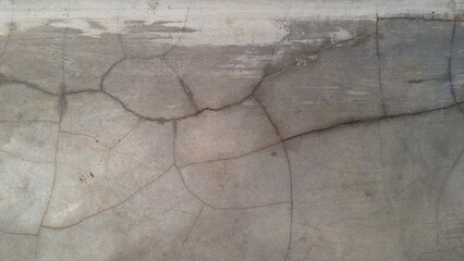 Weathered grunge concrete wall with distressed cement texture, rough aged stone surface for design...