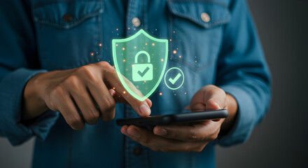 Person Using Smartphone with Green Digital Security Shield and Padlock Icon on Gray Background for Data Protection