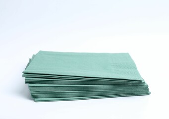 Many green paper handkerchiefs isolated on white