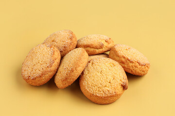 Many sweet cookies on yellow background, closeup