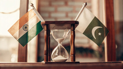 An hourglass where sand flows with Indian and Pakistani flags at opposite ends, symbolizing decades of tension, conflicts and war, AI