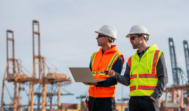 Industrial engineer workers operations marine port cranes loading and unloading of cargo ships global trade and supply chain import export environment monitoring responsible global economy.