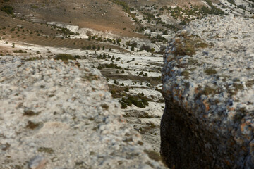 Skateboarding adventure on a rocky cliff with majestic mountain view in the background