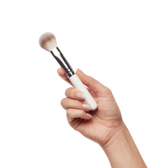 makeup brush in hand isolated on white background