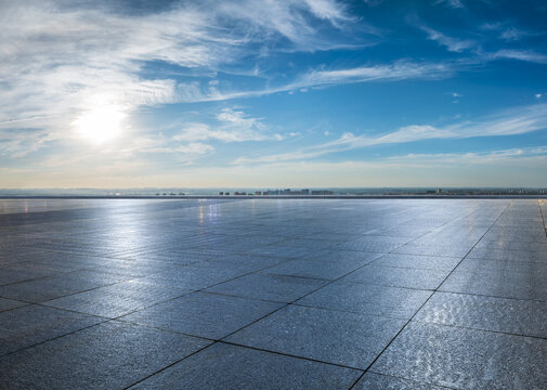 Empty square floor and city skyline with beautiful sky clouds on a sunny day