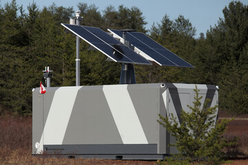 large portable generator with solar panels on roof