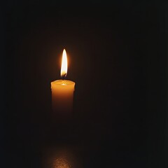 Single candle flame in dark (4)