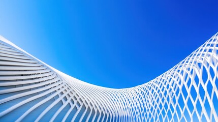 Curved white architectural structure against blue sky