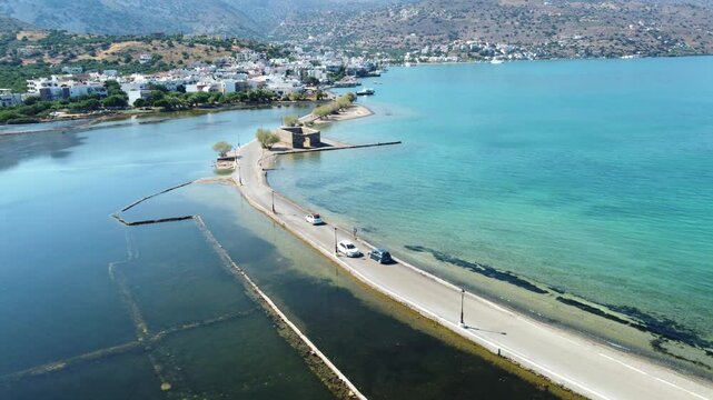 shallow lagoon and turquoise sea in the coastal village of Kato Gouves. Kato Gouves, Crete