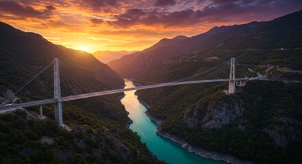Fototapeta premium Suspension Bridge Over Canyon at Sunset