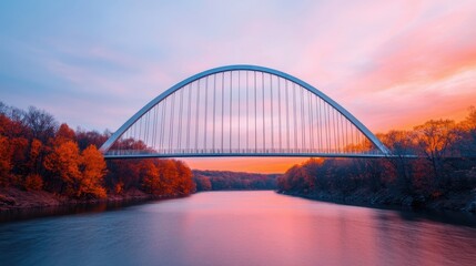 Naklejka premium Stunning Sunset Over Modern Arch Bridge and Autumn Landscape