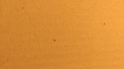 Background of brown kraft paper or cardboard texture. Abstract pattern of beige rough carton, old paper sheet.