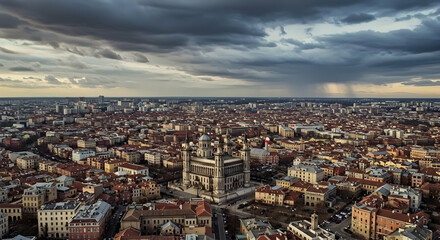 Obraz premium Aerial View of Urban Cityscape with Dramatic Sky and Buildings