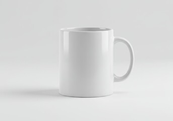 Fototapeta premium Simple white ceramic mug on a plain background for branding mockups and design templates