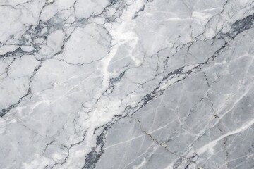Obraz premium White snow lightly blankets the textured stone wall under a cold winter sky with abstract cloud patterns
