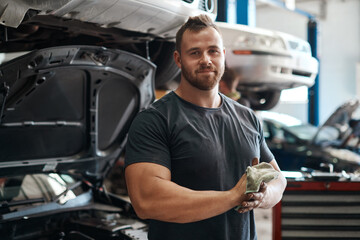 Cleaning, hands and portrait of mechanic in workshop with car service, maintenance or auto...