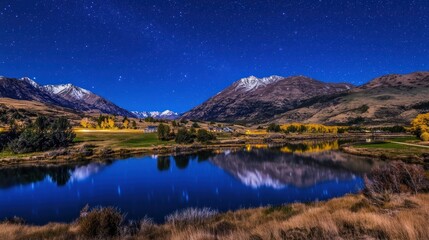 Fototapeta premium Starry night reflection over lake and mountains