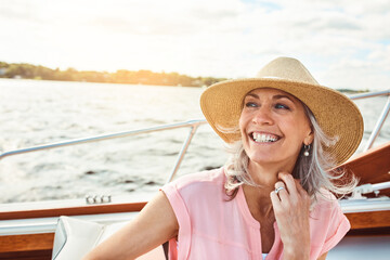Travel, vacation and smile with woman on boat for sailing, adventure and Miami summer. Happy, journey and retirement with mature tourist and luxury on deck of yacht for tropical, cruise and holiday