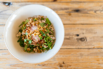 Close up bowl of Thai dry noodle with minced pork. Thai style recipe