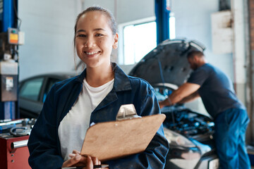 Woman, portrait and clipboard for car services, mechanic and maintenance or safety check at...