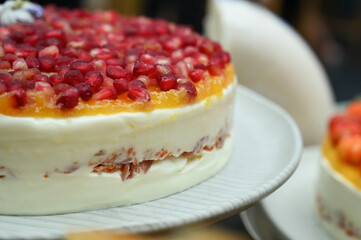 cheesecake ,cheesecake with fruits, pomegranate cheesecake, buffet food, haute cuisine, close up cheesecake