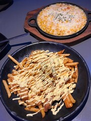 Golden crispy french fries paired with creamy, savory corn cheese. A delicious combination perfect for snack menus, food blogs, party platters, and comfort food promotions!