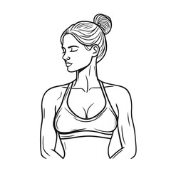 Young woman in sportswear posing confidently with a bun hairstyle  
