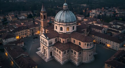 Fototapeta premium Italian church aerial view at dusk with blue dome and red tile roofs