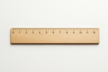 A high-quality image of a wooden ruler on a clean white surface, showcasing clear measurements for precise scaling. Ideal for educational and design projects requiring accuracy.