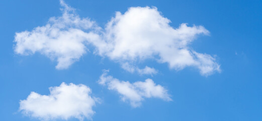 Low angle view of beautiful blue sky with strange shape of clouds in the morning or afternoon on sunny day used as natural background texture in decorative art work