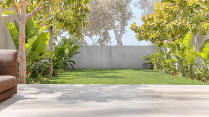 Lush garden with a modern patio and serene green lawn in bright daylight