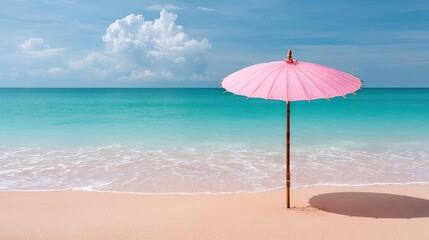 Pink summer vacation with pastel parasol on empty beach concept. A serene beach scene featuring a pink umbrella by the water.