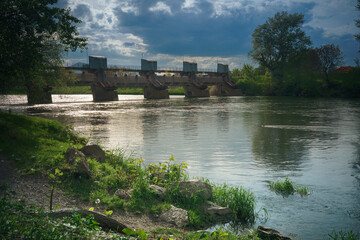 Old dam on the river in spring