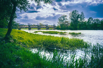 Old dam on the river in spring