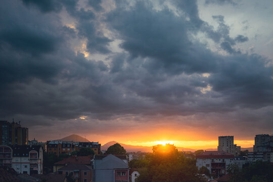 Balkan city at sunset with dramatic sky