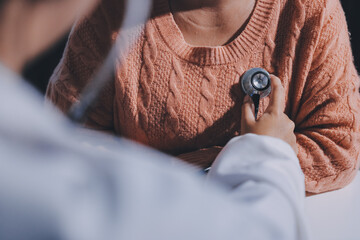 The doctor examines the patient's heart to analyze and listen to whether the heart rhythm is...