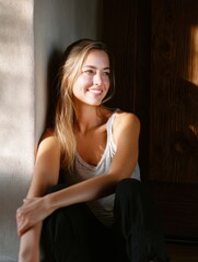Fototapeta premium Serene Woman Seated in Doorway with Natural Light from Terrace